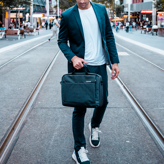 man holding the laptop messenger bag
