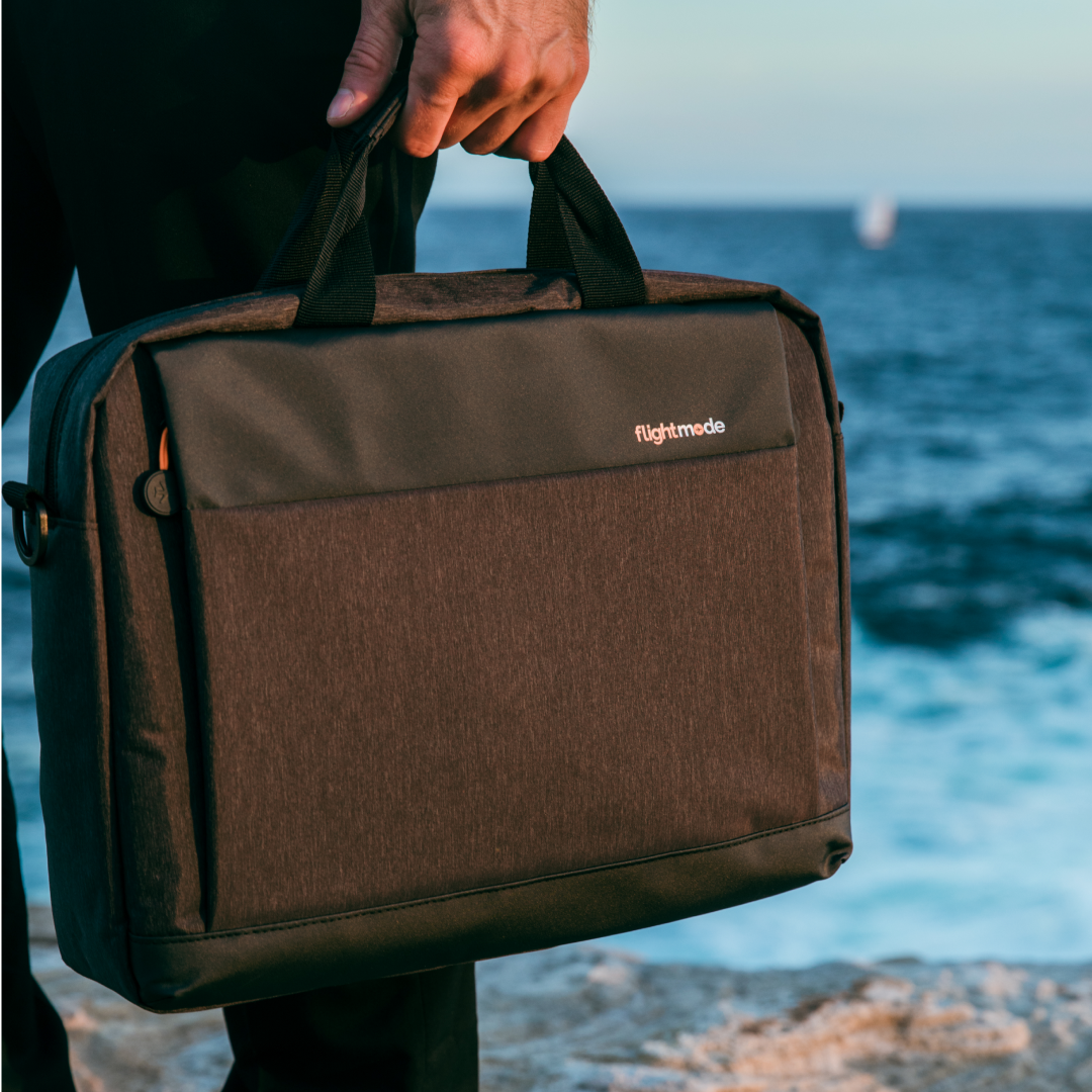 flightmode laptop messenger bag in the beach